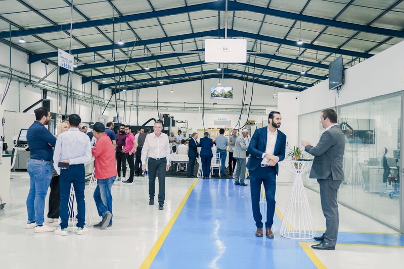Visitors on the machining floor.