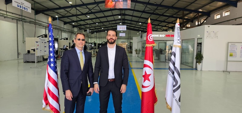 With the flags of the United States, Tunisia and ESM in the machining hall.