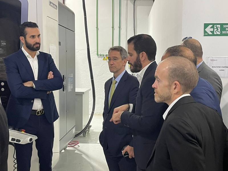 Discussion beside a DMG MORI machining centre.